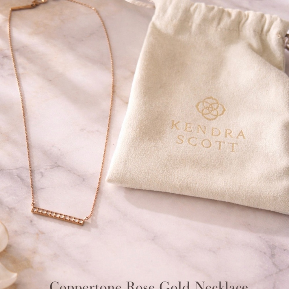 Kendra Scott Copper Rose Gold Necklace with dust bag and earrings.